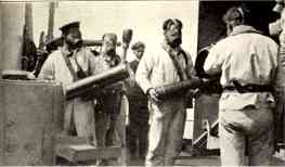 Pre-war picture of the gun crew at the NIELS IUEL's 15 cm guns, wearing gas masks